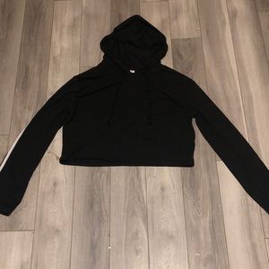 Black croptop two white stripes down the arms.